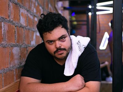 Man finishing weightlifting session with recovery exercises